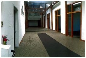 Before: walls limit open views of warehouse prior to construction